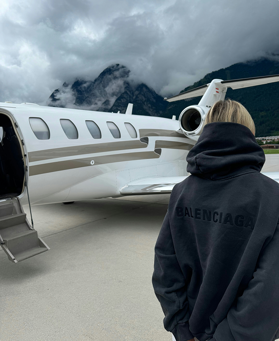 satisfied client preparing to board private jet booked through airacer