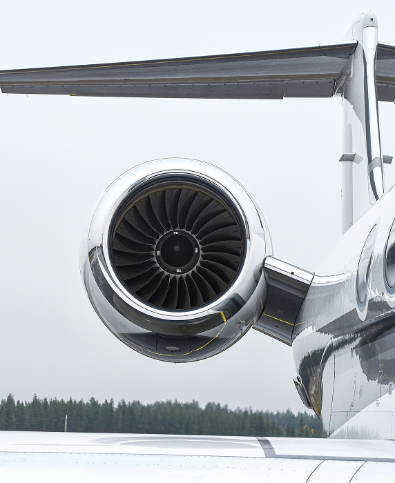 close up of turbine on a private jet on a cloudy day